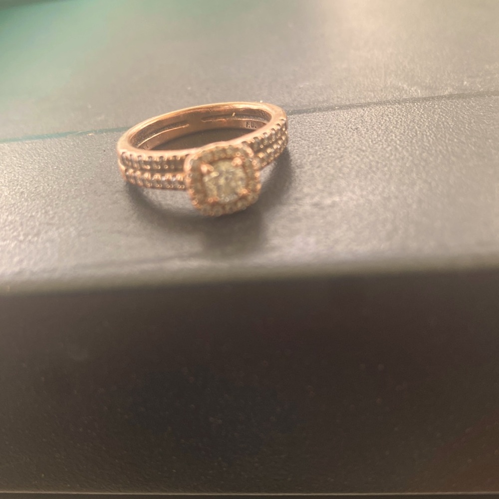 Rose gold wedding set from Kay Jewelers size 4 1/2 spent 2,000 on Both.
